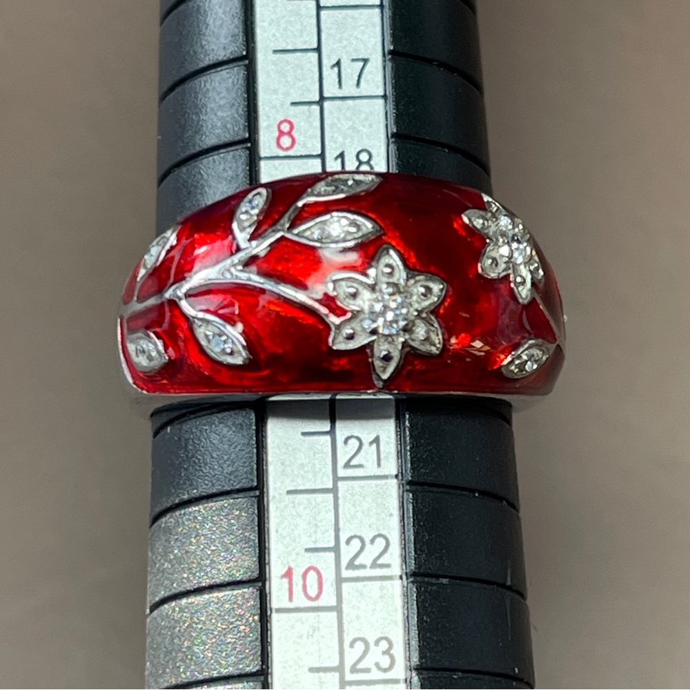 Striking red enameled floral sterling silver marked ring. Size 8 1/2